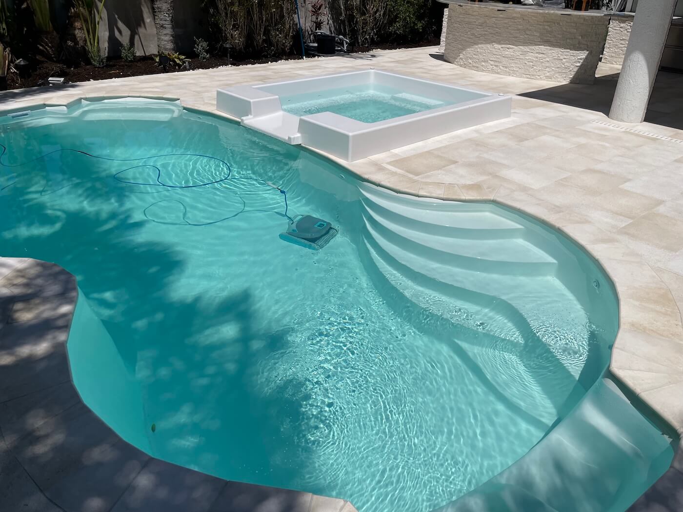 Person working on pool equipment